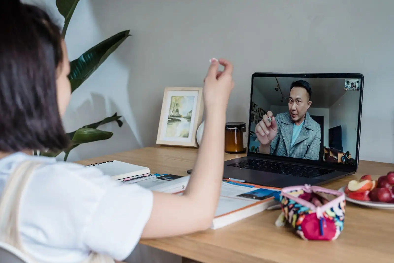 A learner having a one on one online lesson with a tutor on a laptop